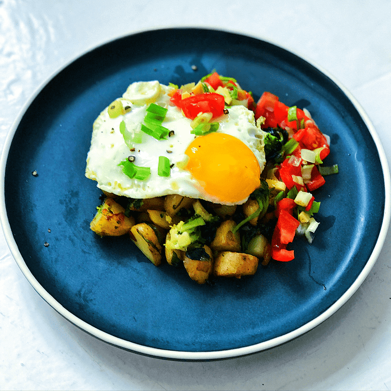 Saag aloo med ristede kartofler, spinat, korianderfrø, ingefær og spejlæg